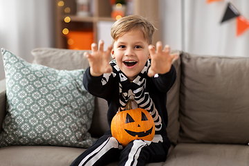 Image showing happy boy in halloween costume of skeleton at home