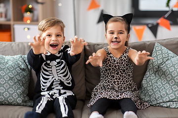 Image showing kids in halloween costumes having fun at home