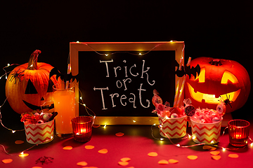 Image showing pumpkins, candies and halloween decorations