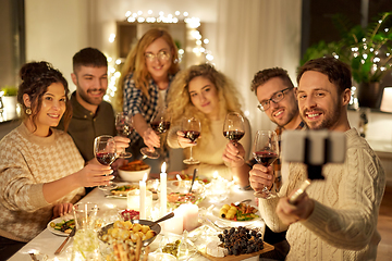 Image showing friends taking selfie at christmas dinner party