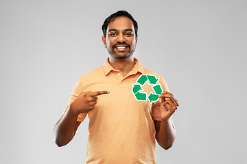 Image showing smiling indian man holding green recycling sign