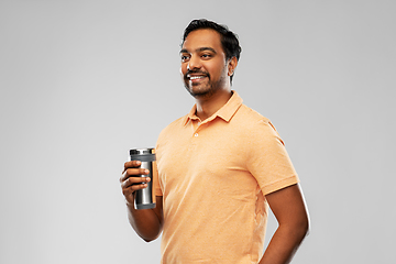 Image showing indian man with thermo cup or tumbler for drink