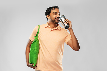 Image showing man with food in bag and tumbler or thermo cup