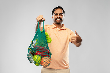 Image showing happy indian man with food in reusable net tote