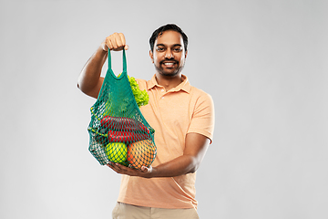 Image showing happy indian man with food in reusable net tote