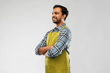 Image showing happy indian male gardener or farmer in apron