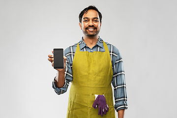 Image showing indian male gardener or farmer with smartphone