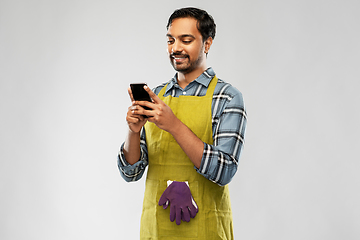 Image showing indian male gardener or farmer with smartphone