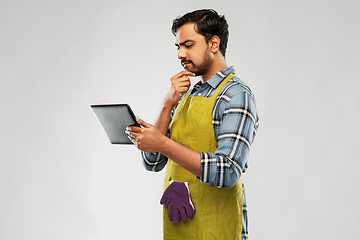 Image showing indian male gardener or farmer with tablet pc