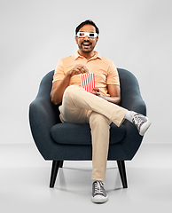 Image showing happy man in 3d movie glasses eating popcorn