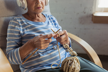 Image showing Senior woman studying at home, getting online courses