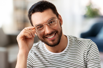 Image showing portrait of happy smiling man in glasses at home