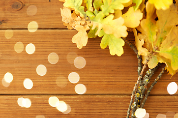 Image showing oak leaves in autumn colors on wooden table