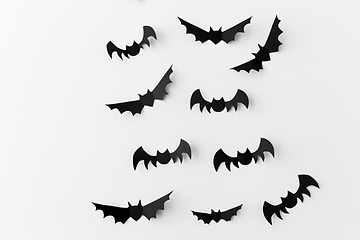 Image showing flock of black paper bats over white background