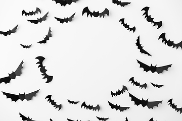 Image showing flock of black paper bats over white background