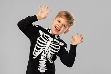 Image showing boy in halloween costume of skeleton making faces