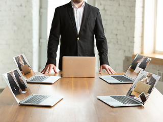 Image showing Business meeting online during coronavirus quarantine. All the meetings coming to remote way, office work