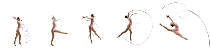 Image showing Little flexible girl isolated on white studio background. Little female rhythmic gymnastics artist in bright leotard