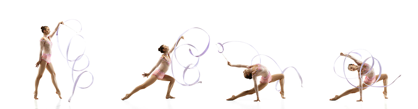 Image showing Little flexible girl isolated on white studio background. Little female rhythmic gymnastics artist in bright leotard