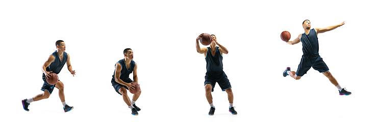 Image showing Young basketball player against white studio background in motion of step-to-step goal