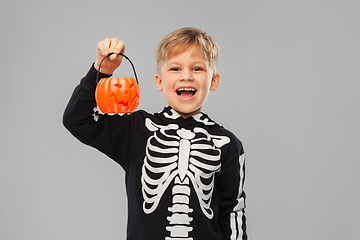 Image showing happy boy in halloween costume with jack-o-lantern