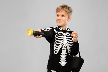 Image showing happy with candies and flashlight on halloween