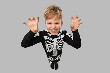 Image showing boy in halloween costume of skeleton making faces