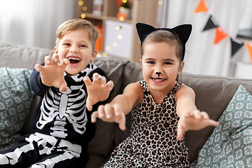 Image showing kids in halloween costumes having fun at home