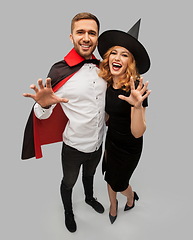 Image showing couple in halloween costumes of witch and vampire