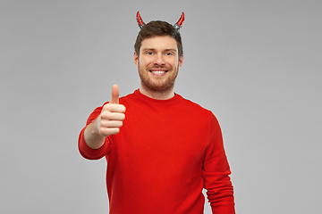 Image showing happy man in costume of devil showing thumbs up