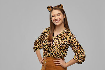 Image showing happy woman in halloween costume of leopard