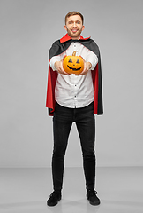 Image showing man in halloween costume of vampire with pumpkin