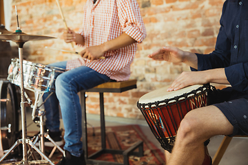 Image showing Musician band jamming together in art workplace with instruments