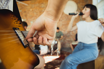 Image showing Musician band jamming together in art workplace with instruments