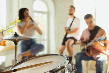 Image showing Musician band jamming together in art workplace with instruments