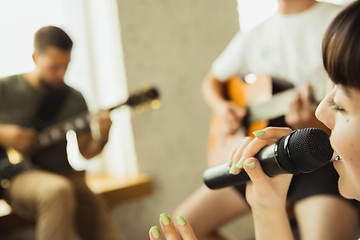 Image showing Musician band jamming together in art workplace with instruments