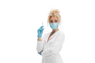 Image showing Portrait of female doctor, nurse or cosmetologist in white uniform and blue gloves over white background