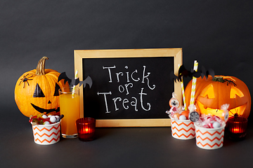 Image showing pumpkins, candies and halloween decorations