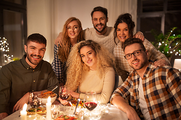 Image showing friends taking selfie at christmas dinner party