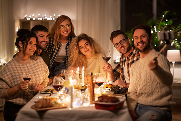 Image showing friends taking selfie at christmas dinner party