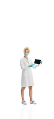 Image showing Portrait of female doctor, nurse or cosmetologist in white uniform and blue gloves over white background