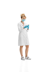 Image showing Portrait of female doctor, nurse or cosmetologist in white uniform and blue gloves over white background