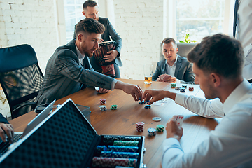 Image showing Happy colleagues having fun in office while their colleagues working hard