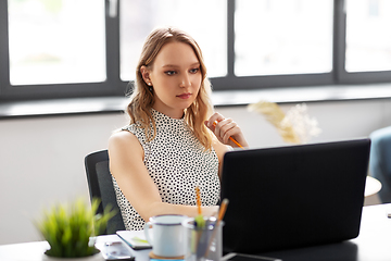 Image showing businesswoman with laptop working at office