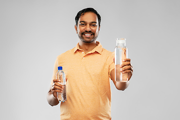 Image showing indian man comparing water in different bottles