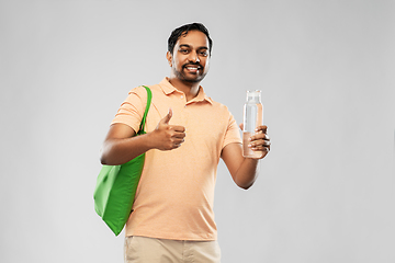 Image showing man with bag for food shopping and glass bottle