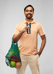 Image showing man with food in bag and tumbler or thermo cup