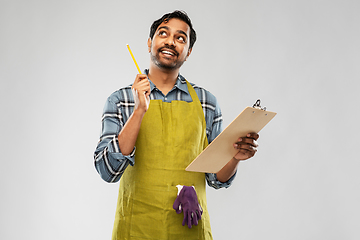 Image showing indian gardener or farmer with clipboard thinking