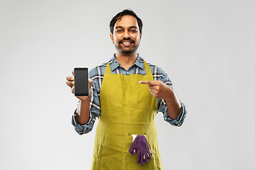 Image showing indian male gardener or farmer with smartphone