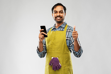 Image showing indian male gardener or farmer with smartphone